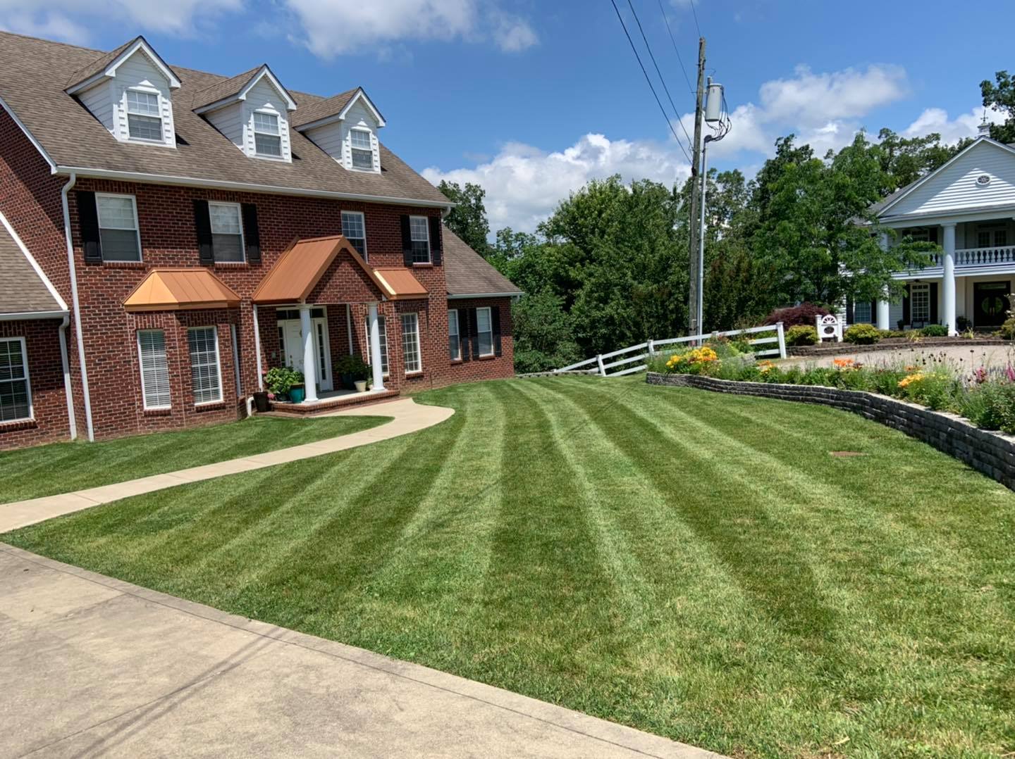 A house with a lawn in the middle of it